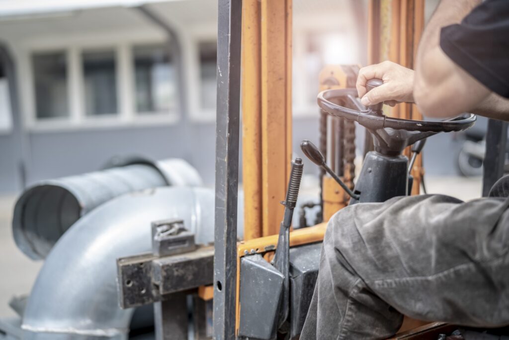 Jungheinrich Fork lift driver moving equipment