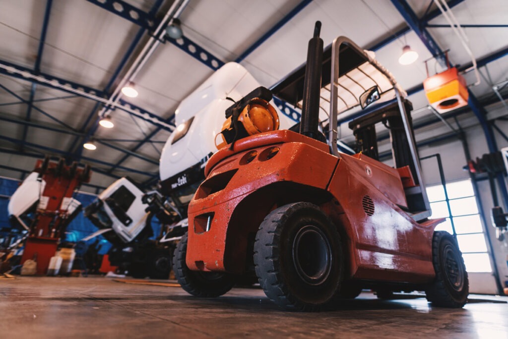 A used orange forklift in El Paso.